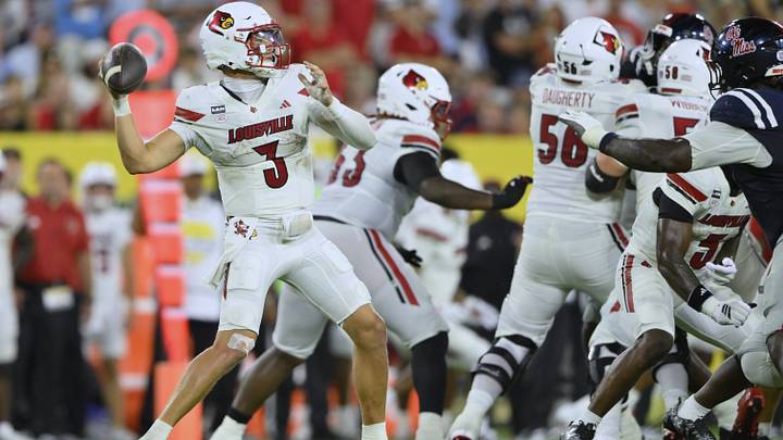 Sep 6, 2026; Nashville, Tennessee, USA;  Louisville Cardinals quarterback Lincoln Kienholz (3) throws a touchdown pass against the Mississippi Rebels during the third quarter at Nissan Stadium.  Mandatory Credit: Steve Roberts-Imagn Images