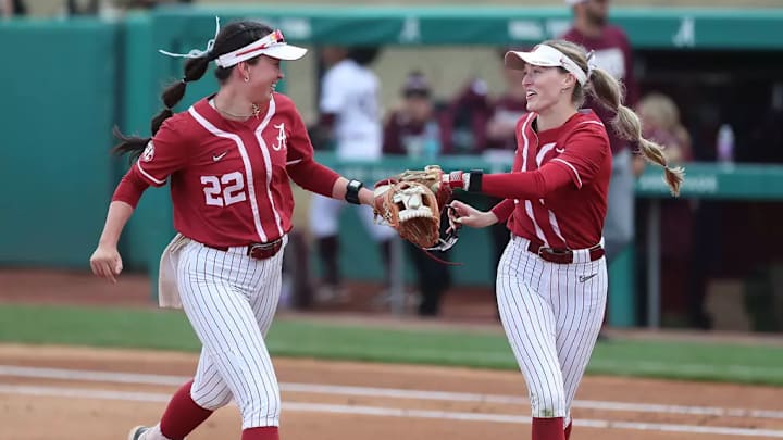 Alabama Softball Player Kali Heivilin (22) and Alabama Softball Player Larissa Preuitt (11) celebrate at Rhoads Stadium in Tuscaloosa, AL on Sunday, Mar 16, 2025.