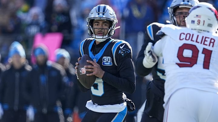 Dec 22, 2024; Charlotte, North Carolina, USA; Carolina Panthers quarterback Bryce Young (9) looks for a receiver against the Arizona Cardinals during the second quarter at Bank of America Stadium.