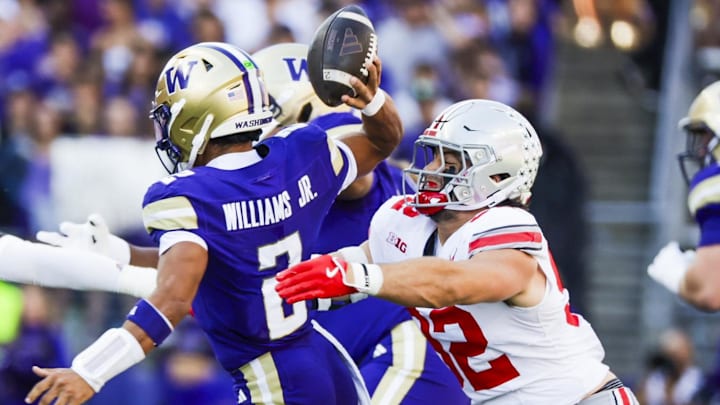 Sep 27, 2025; Seattle, Washington, USA; Ohio State Buckeyes defensive end Caden Curry (92) sacks Washington Huskies quarterback Demond Williams Jr. (2) during the second quarter at Husky Stadium. Mandatory Credit: Joe Nicholson-Imagn Images