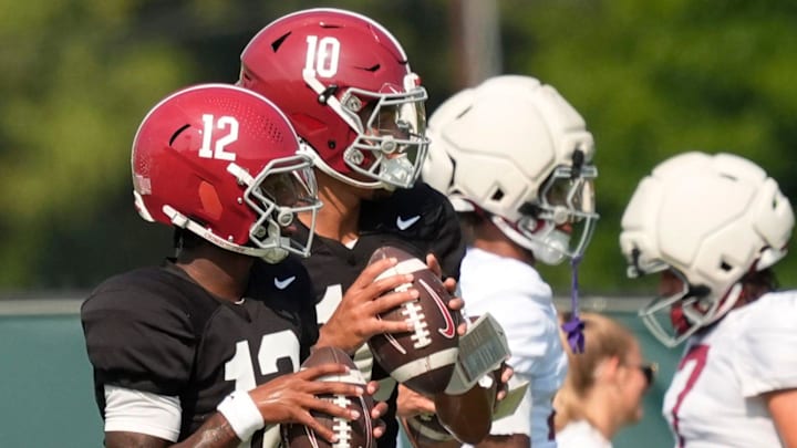 Quarterbacks Keelon Russell and Austin Mack throw during practice for the Alabama Crimson Tide.