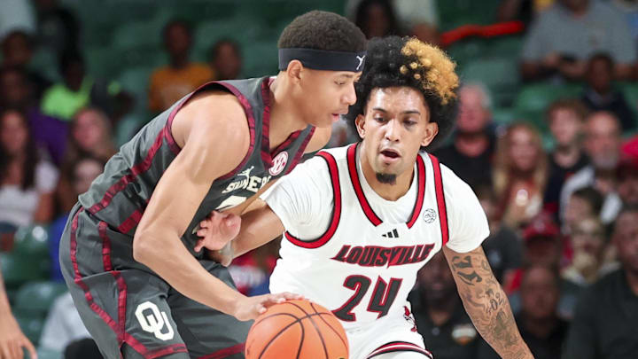 Nov 29, 2024; Paradise Island, Bahamas, BHS; Oklahoma Sooners guard Jeremiah Fears (0) dribbles as Louisville Cardinals guard Chucky Hepburn (24) defends during the first half at Imperial Arena at the Atlantis resort. Nov 29, 2024; Paradise Island, Bahamas, BHS; Oklahoma Sooners guard Jeremiah Fears (0) dribbles as Louisville Cardinals guard Chucky Hepburn (24) defends during the first half at Imperial Arena at the Atlantis resort.