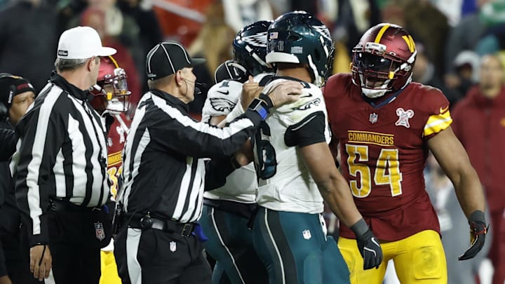 Dec 20, 2025; Landover, Maryland, USA; Washington Commanders linebacker Bobby Wagner (54) argues with Philadelphia Eagles running back Saquon Barkley (26) after a fight in the fourth quarter at Northwest Stadium. Mandatory Credit: Geoff Burke-Imagn Images