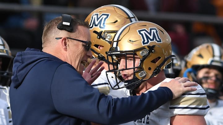 Nov 22, 2025; Missoula, MT, USA; Montana State Bobcats head coach Brent Vigen speaks to defensive end Kenneth Eiden IV (11) during the second half against the Montana Grizzlies at Washington-Grizzly Stadium. Mandatory Credit: Michael Thomas Shroyer-Imagn Images