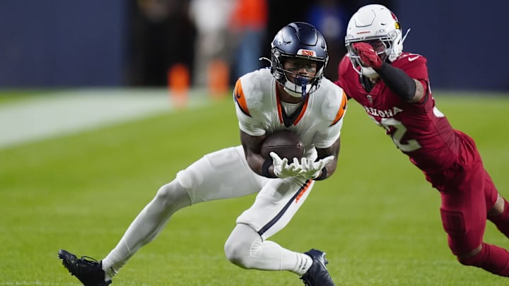 Aug 16, 2025; Denver, Colorado, USA; Arizona Cardinals safety Joey Blount (32) defends on Denver Broncos wide receiver Troy Franklin (11) in the second quarter at Empower Field at Mile High.