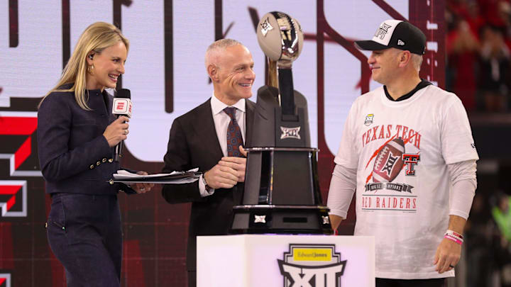 Texas Tech head coach Joey McGuire stands with commissioner Brett Yormark (middle) and ESPN's Katie Georgie after winning Big 12 Championship football game, Saturday, Nov. 6, 2025, at AT&T Stadium in Arlington.