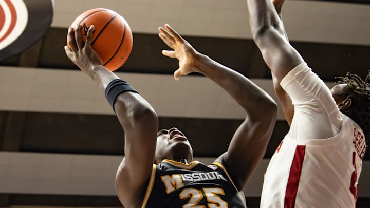Missouri Tigers forward Mark Mitchell (25) goes up for a shot against a Alabama defender during the first half at Coleman Coliseum