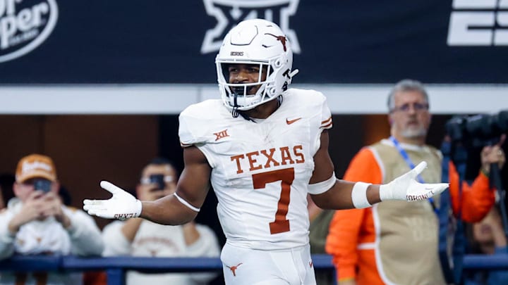 Dec 2, 2023; Arlington, TX, USA; Texas Longhorns running back Keilan Robinson (7) reacts after scoring a touchdown during the second half against the Oklahoma State Cowboys at AT&T Stadium. Mandatory Credit: Kevin Jairaj-Imagn Images Dec 2, 2023; Arlington, TX, USA; Texas Longhorns running back Keilan Robinson (7) reacts after scoring a touchdown during the second half against the Oklahoma State Cowboys at AT&T Stadium. Mandatory Credit: Kevin Jairaj-Imagn Images