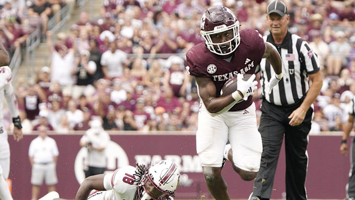 Oct 28, 2023; College Station, Texas, USA; Texas A&M Aggies running back Amari Daniels (4) runs against South Carolina Gamecocks during the second half at Kyle Field. Mandatory Credit: Dustin Safranek-Imagn Images