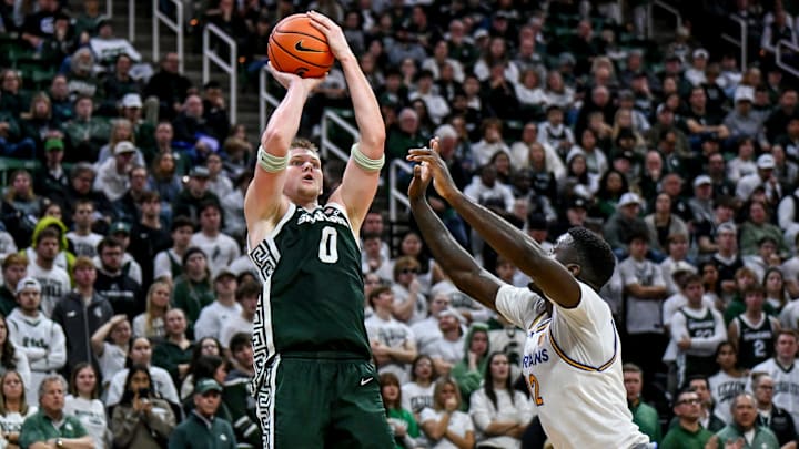 Michigan State's Jaxon Kohler, left, scores against San Jose State's Yaphet Moundi during the second half on Thursday, Nov. 13, 2025, at the Breslin Center in East Lansing.