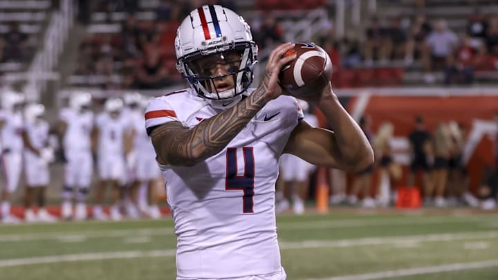 Arizona Wildcats WR Tetairoa McMillan warms up before a game against the Utah Utes at Rice-Eccles Stadium. Arizona Wildcats WR Tetairoa McMillan warms up before a game against the Utah Utes at Rice-Eccles Stadium.