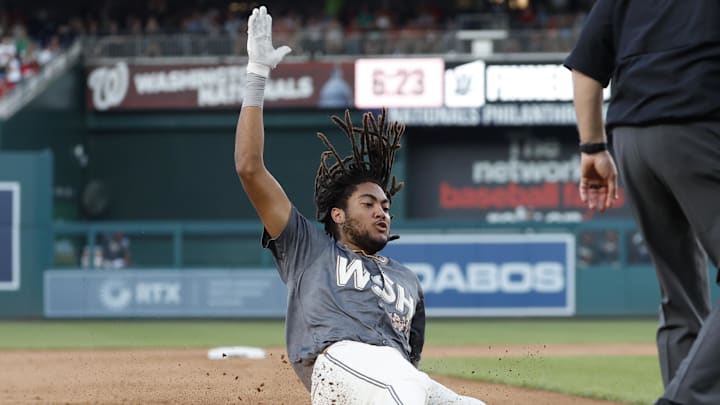 Sep 28, 2024; Washington, District of Columbia, USA; Washington Nationals outfielder James Wood (29) slides into third base after hitting a triple against the Philadelphia Phillies during the eighth inning at Nationals Park. Sep 28, 2024; Washington, District of Columbia, USA; Washington Nationals outfielder James Wood (29) slides into third base after hitting a triple against the Philadelphia Phillies during the eighth inning at Nationals Park.