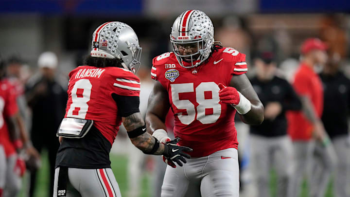 Ohio State Buckeyes safety Lathan Ransom (8) and Ohio State Buckeyes defensive tackle Ty Hamilton (58) do a hand shake during final warm ups at the Cotton Bowl Classic before their game against Texas Longhorns in the College Football Playoff semifinal game at AT&T Stadium in Arlington, Texas on January, 10, 2025.
