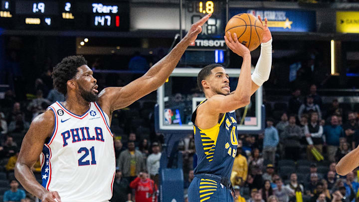 Mar 6, 2023; Indianapolis, Indiana, USA; Indiana Pacers guard Tyrese Haliburton (0) shoots the ball while Philadelphia 76ers center Joel Embiid (21) defends in the second half at Gainbridge Fieldhouse. Mandatory Credit: Trevor Ruszkowski-Imagn Images Mar 6, 2023; Indianapolis, Indiana, USA; Indiana Pacers guard Tyrese Haliburton (0) shoots the ball while Philadelphia 76ers center Joel Embiid (21) defends in the second half at Gainbridge Fieldhouse. Mandatory Credit: Trevor Ruszkowski-Imagn Images