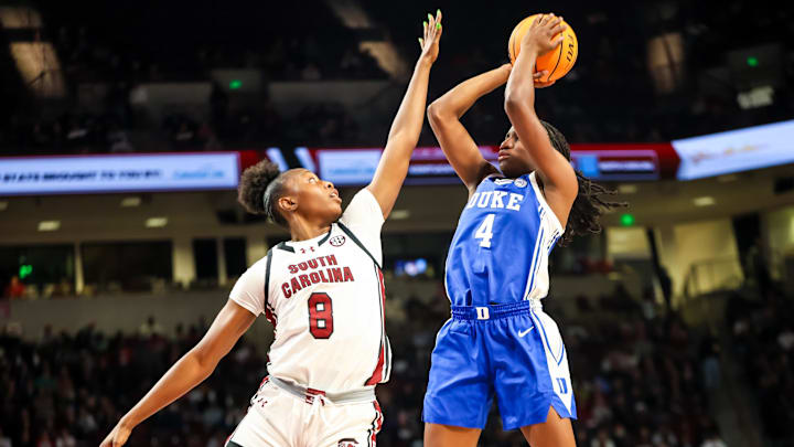 Dec 5, 2024; Columbia, South Carolina, USA; Duke Blue Devils guard Jadyn Donovan (4) shoots over South Carolina Gamecocks forward Joyce Edwards (8) in the second half at Colonial Life Arena. Mandatory Credit: Jeff Blake-Imagn Images