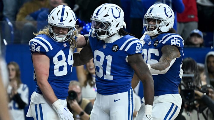 Nov 30, 2025; Indianapolis, Indiana, USA; Indianapolis Colts tight end Tyler Warren (84) celebrates with tight end Mo Alie-Cox (81) and tight end Drew Ogletree (85) after a touchdown during the second half against the Houston Texans at Lucas Oil Stadium. Mandatory Credit: Robert Goddin-Imagn Images