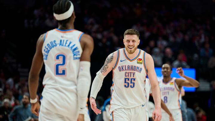 Jan 26, 2025; Portland, Oregon, USA; Oklahoma City Thunder center Isaiah Hartenstein (55) celebrates with guard Shai Gilgeous-Alexander (2) during a break in the second half against the Portland Trail Blazers at Moda Center. Mandatory Credit: Troy Wayrynen-Imagn Images