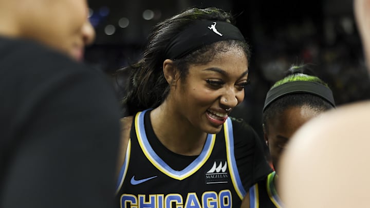 Chicago Sky forward Angel Reese (5) smiles in the team huddle after a win over the Indiana Fever.