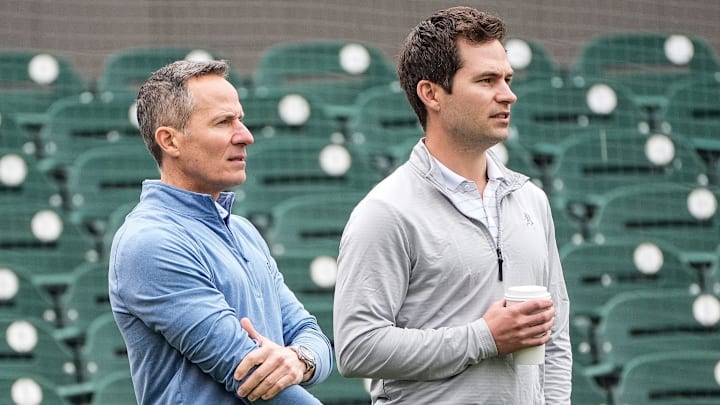 Detroit Tigers team owner Chris Ilitch, left, talks to president of baseball operation Scott Harris as they watch batting practice during spring training at Joker Marchant Stadium in Lakeland, Fla. on Thursday, Feb. 20, 2025.