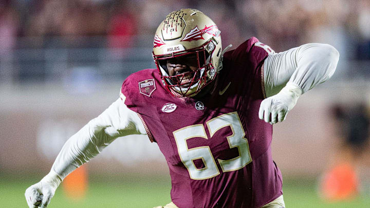 Florida State Seminoles offensive lineman Jeremiah Byers (63) celebrates a first down. The Florida State Seminoles defeated the Miami Hurricanes 27-20 on Saturday, Nov. 11, 2023.