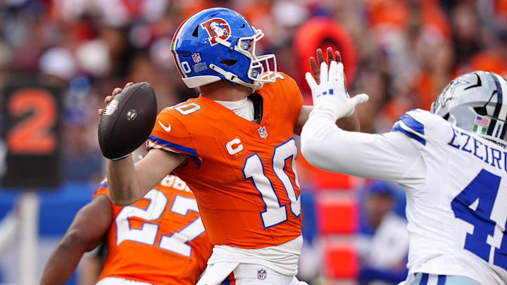 Denver Broncos quarterback Bo Nix throws a pass against Dallas Cowboys defensive end Donovan Ezeiruaku. Denver Broncos quarterback Bo Nix throws a pass against Dallas Cowboys defensive end Donovan Ezeiruaku.
