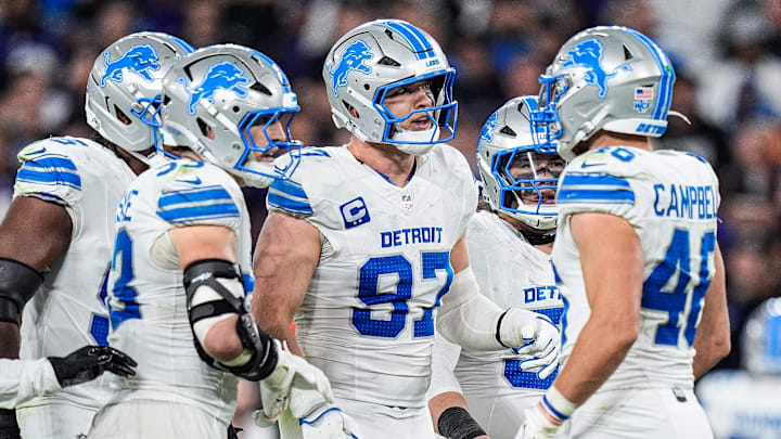 Detroit Lions defensive end Aidan Hutchinson (97), center, talks to teammates before a play against Baltimore Ravens during the second half at M&T Bank Stadium in Baltimore, Md. on Monday, Sept. 22, 2025.