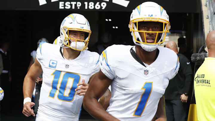 Sep 22, 2024; Pittsburgh, Pennsylvania, USA;  Los Angeles Chargers quarterback Justin Herbert (10) and wide receiver Quentin Johnston (1) take the field against the Pittsburgh Steelers at Acrisure Stadium. Mandatory Credit: Charles LeClaire-Imagn Images