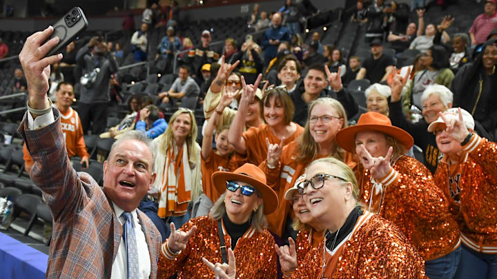 Texas Longhorns head coach Vic Schaefer takes a photo with Texas Longhorns fans Sunday, March 8, 2026, after the SEC Women's Basketball Tournament Championship game against the South Carolina Gamecocks at Bon Secours Wellness Arena in Greenville, South Carolina. Texas Longhorns won 78-61.
