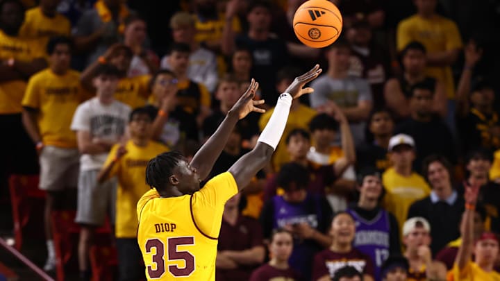 Mar 3, 2026; Tempe, Arizona, USA; Arizona State Sun Devils center Massamba Diop (35) shoots a three pointer against the Kansas Jayhawks in the first half at Desert Financial Arena. Mandatory Credit: Mark J. Rebilas-Imagn Images