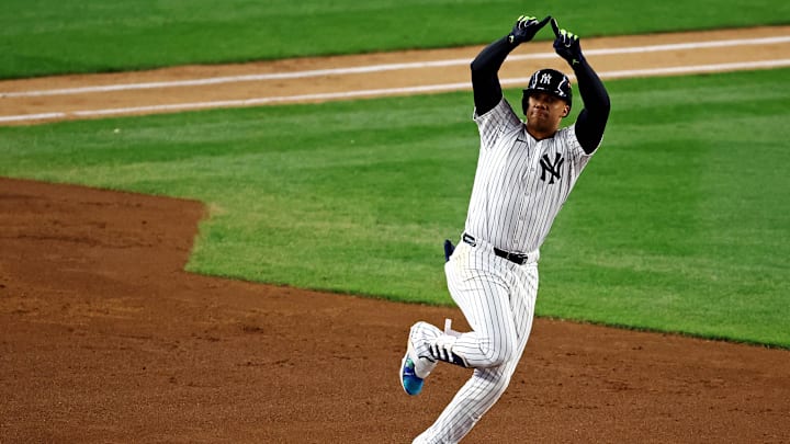 Oct 14, 2024; Bronx, New York, USA; New York Yankees outfielder Juan Soto (22) runs the bases after hitting a solo home run during the third inning against the Cleveland Guardians in game one of the ALCS for the 2024 MLB Playoffs at Yankee Stadium. Mandatory Credit: Vincent Carchietta-Imagn Images