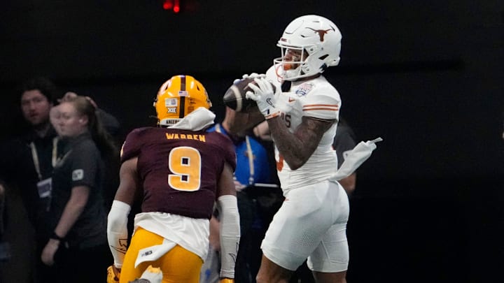 Texas wide receiver DeAndre Moore Jr. catches a touchdown pass against Arizona State defensive back Montana Warren