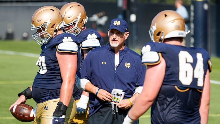 Notre Dame offensive line coach Joe Rudolph, center, leads a drill during a football practice at Irish Athletic Center on Wednesday, Aug. 6, 2025, in South Bend.