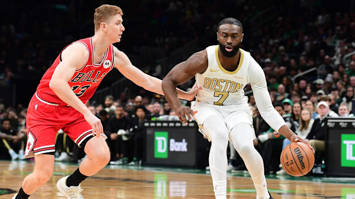 Jan 5, 2026; Boston, Massachusetts, USA;  Boston Celtics guard Jaylen Brown (7) controls the ball while Chicago Bulls guard Kevin Huerter (13) defends during the first half at TD Garden. Mandatory Credit: Bob DeChiara-Imagn Images