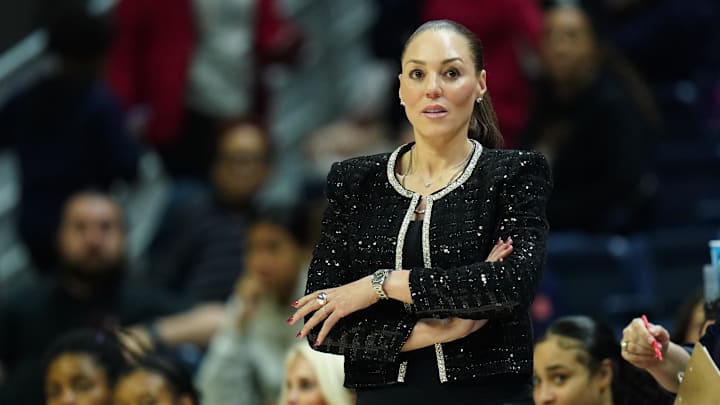Mar 23, 2024; Storrs, Connecticut, USA; Arizona Wildcats head coach Adia Barnes watches from the sideline as they take on the Syracuse Orange at Harry A. Gampel Pavilion. Mandatory Credit: David Butler II-Imagn Images Mar 23, 2024; Storrs, Connecticut, USA; Arizona Wildcats head coach Adia Barnes watches from the sideline as they take on the Syracuse Orange at Harry A. Gampel Pavilion. Mandatory Credit: David Butler II-Imagn Images