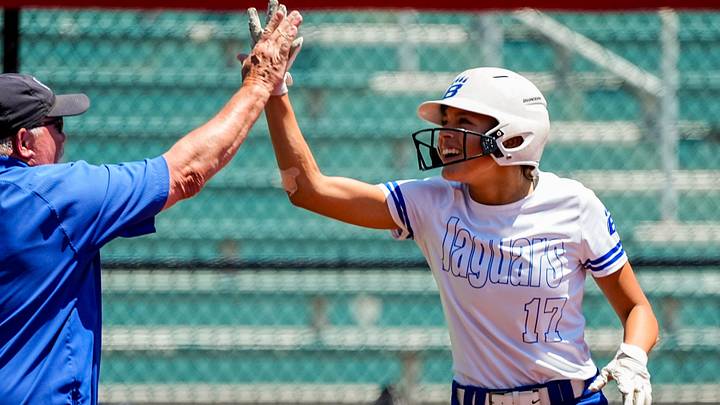 Hilliard Bradley’s Sophia Lopez (17) celebrates an RBI triple during an OHSAA DI state semifinal softball game against Centerville, June 3, 2026, at Firestone Stadium in Akron, Ohio.