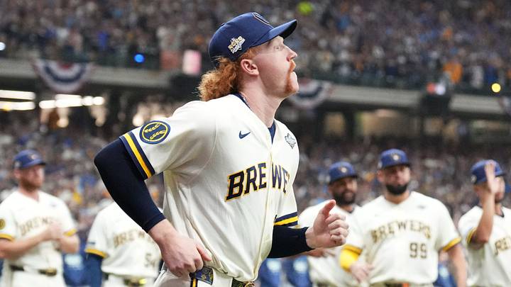 Oct 23, 2026; Milwaukee, Wisconsin, USA; Milwaukee Brewers pitcher Dustin May (21) runs onto the field during player introductions before game one of the 2026 World Series against the Tampa Bay Rays at American Family Field. Mandatory Credit: Michael McLoone-Imagn Images Oct 23, 2026; Milwaukee, Wisconsin, USA; Milwaukee Brewers pitcher Dustin May (21) runs onto the field during player introductions before game one of the 2026 World Series against the Tampa Bay Rays at American Family Field. Mandatory Credit: Michael McLoone-Imagn Images