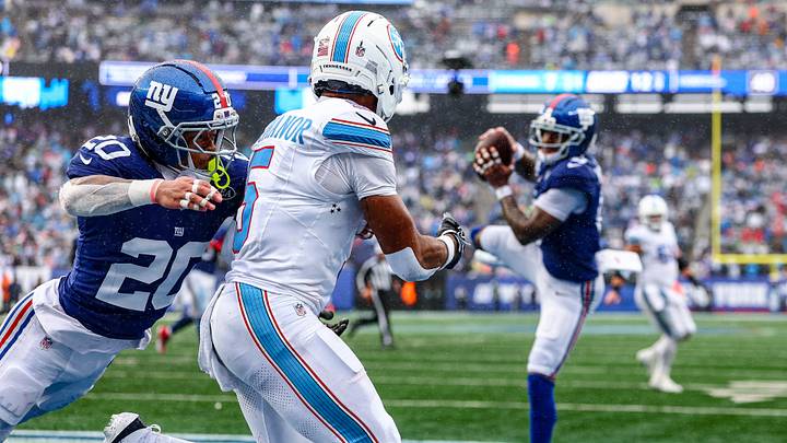 Sep 27, 2026; East Rutherford, New Jersey, USA; New York Giants safety Jevon Holland (8) intercepts a pass intended for Tennessee Titans wide receiver Elic Ayomanor (5) as cornerback Greg Newsome II (20) defends during the fourth quarter at MetLife Stadium. Mandatory Credit: Vincent Carchietta-Imagn Images Sep 27, 2026; East Rutherford, New Jersey, USA; New York Giants safety Jevon Holland (8) intercepts a pass intended for Tennessee Titans wide receiver Elic Ayomanor (5) as cornerback Greg Newsome II (20) defends during the fourth quarter at MetLife Stadium. Mandatory Credit: Vincent Carchietta-Imagn Images