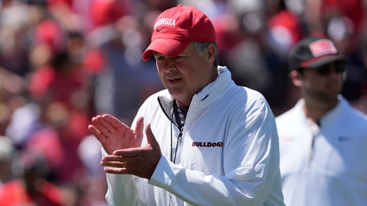 Georgia assistant coach and offensive line coach Stacy Searels works with his unit during warm ups before the start of the Georgia G-Day spring football game in Athens, Ga., on Saturday, April 12, 2025.