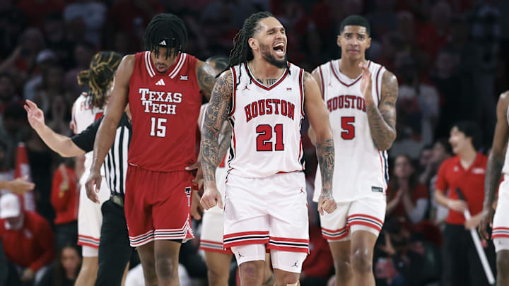 Jan 6, 2026; Houston, Texas, USA; Houston Cougars guard Emanuel Sharp (21) reacts after a play during the second half against the Texas Tech Red Raiders at Fertitta Center. Mandatory Credit: Troy Taormina-Imagn Images