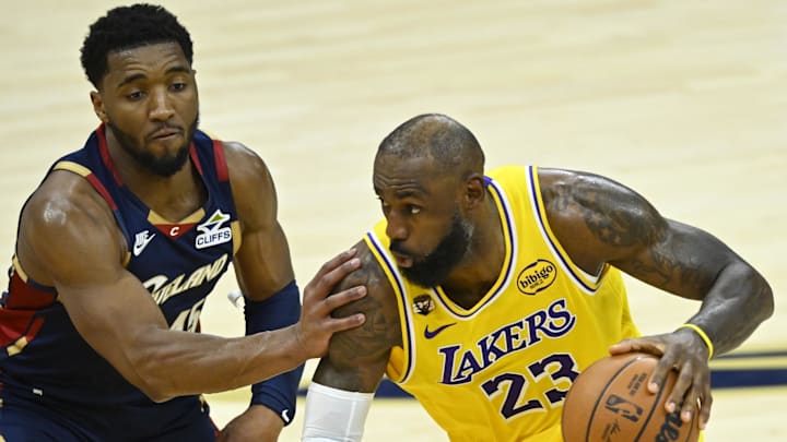 Jan 28, 2026; Cleveland, Ohio, USA; Cleveland Cavaliers guard Donovan Mitchell (45) defends Los Angeles Lakers forward LeBron James (23) in the fourth quarter at Rocket Arena. Mandatory Credit: David Richard-Imagn Images Jan 28, 2026; Cleveland, Ohio, USA; Cleveland Cavaliers guard Donovan Mitchell (45) defends Los Angeles Lakers forward LeBron James (23) in the fourth quarter at Rocket Arena. Mandatory Credit: David Richard-Imagn Images