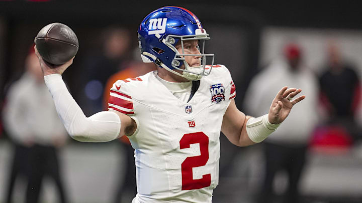 Dec 22, 2024; Atlanta, Georgia, USA; New York Giants quarterback Drew Lock (2) passes against the Atlanta Falcons during the first quarter at Mercedes-Benz Stadium. Mandatory Credit: Dale Zanine-Imagn Images