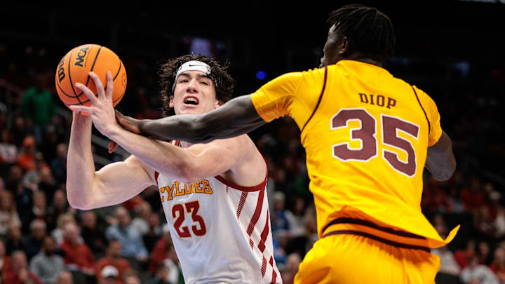 Mar 11, 2026; Kansas City, MO, USA; Iowa State Cyclones forward Blake Buchanan (23) drives to the basket around Arizona State Sun Devils center Massamba Diop (35) during the first half at T-Mobile Center. Mandatory Credit: William Purnell-Imagn Images