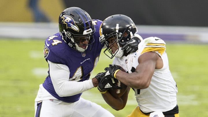 Nov 1, 2020; Baltimore, Maryland, USA;  Pittsburgh Steelers wide receiver JuJu Smith-Schuster (19) fights for extra yards as Baltimore Ravens cornerback Marlon Humphrey (44) defends during the second half at M&T Bank Stadium. Mandatory Credit: Tommy Gilligan-Imagn Images