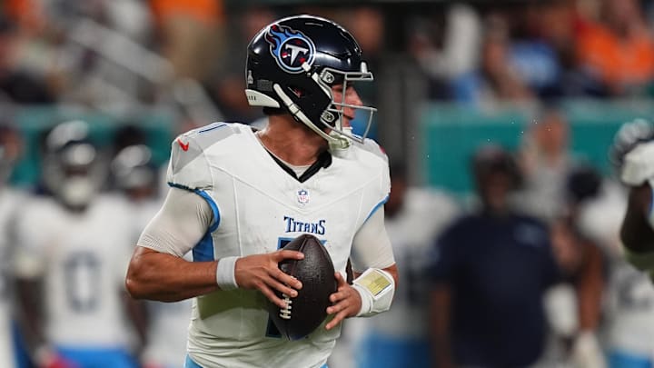 Sep 30, 2024; Miami Gardens, Florida, USA; Tennessee Titans quarterback Mason Rudolph (11) drops back with the ball during the second half against the Miami Dolphins at Hard Rock Stadium.