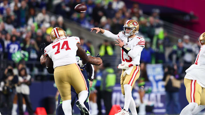 Jan 17, 2026; Seattle, WA, USA; San Francisco 49ers quarterback Brock Purdy (13) throws a pass against the Seattle Seahawks during the first half in an NFC Divisional Round game at Lumen Field. Mandatory Credit: Kevin Ng-Imagn Images