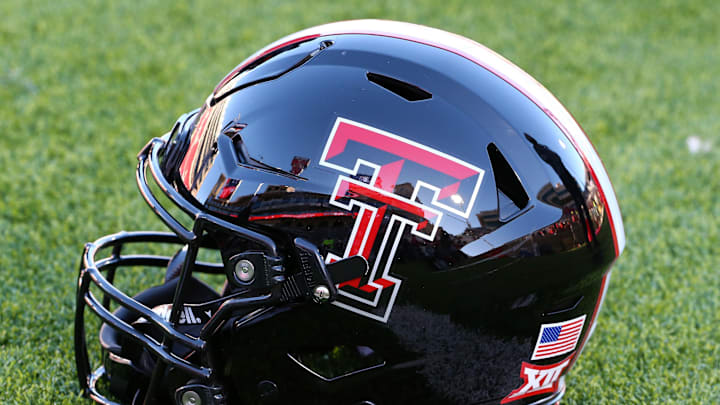 Nov 30, 2024; Lubbock, Texas, USA; A general view of a Texas Tech Red Raiders helmet on the field before the game between the West Virginia Mountaineers and the Texas Tech Red Raiders at Jones AT&T Stadium and Cody Campbell Field. Mandatory Credit: Michael C. Johnson-Imagn Images Nov 30, 2024; Lubbock, Texas, USA; A general view of a Texas Tech Red Raiders helmet on the field before the game between the West Virginia Mountaineers and the Texas Tech Red Raiders at Jones AT&T Stadium and Cody Campbell Field. Mandatory Credit: Michael C. Johnson-Imagn Images