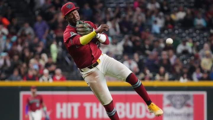 Arizona Diamondbacks infielder Geraldo Perdomo (2) throws to first base after fielding a grounder against the Colorado Rockies on March 31, 2024, at Chase Field in Phoenix.