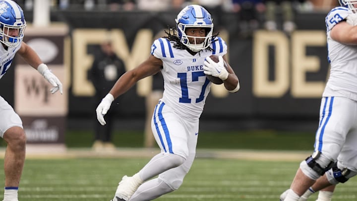 Nov 30, 2024; Winston-Salem, North Carolina, USA; Duke Blue Devils running back Star Thomas (17) runs for yardage against the Wake Forest Demon Deacons during the second half at Allegacy Federal Credit Union Stadium. Mandatory Credit: Jim Dedmon-Imagn Images