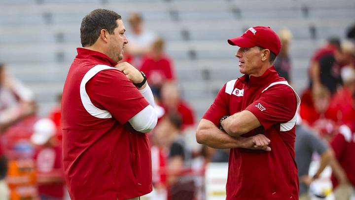 Oklahoma Sooners offensive coordinator Jeff Lebby speaks with head coach Brent Venables before the game against the Nebraska Cornhuskers at Memorial Stadium. Mandatory Credit: Kevin Jairaj-Imagn Images