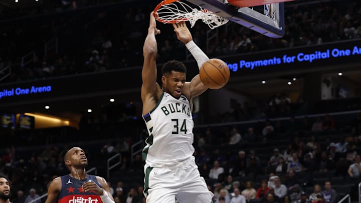 Dec 1, 2025; Washington, District of Columbia, USA; Milwaukee Bucks forward Giannis Antetokounmpo (34) dunks the ball as Washington Wizards forward Khris Middleton (22) looks on in the second quarter at Capital One Arena. Mandatory Credit: Geoff Burke-Imagn Images